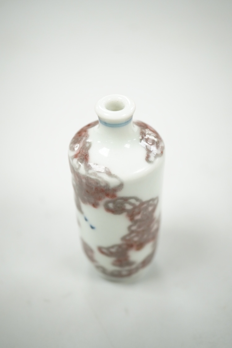 A Chinese cinnabar lacquer snuff bottle, a glass overlay snuff bottle and an underglaze copper red snuff bottle-9cm high (3)